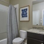 Bathroom with vanity and shower in an apartment rental - Elements at Prairie Center