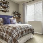 Apartment bedroom with window and furnishings - Elements at Prairie Center