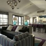 Apartment clubhouse with living room and kitchen - Elements at Prairie Center