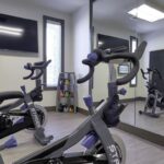 Two stationary bikes at an apartment fitness center - Elements at Prairie Center
