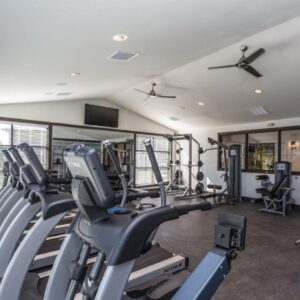 a row of exercise machines at Elements at Prairie Center