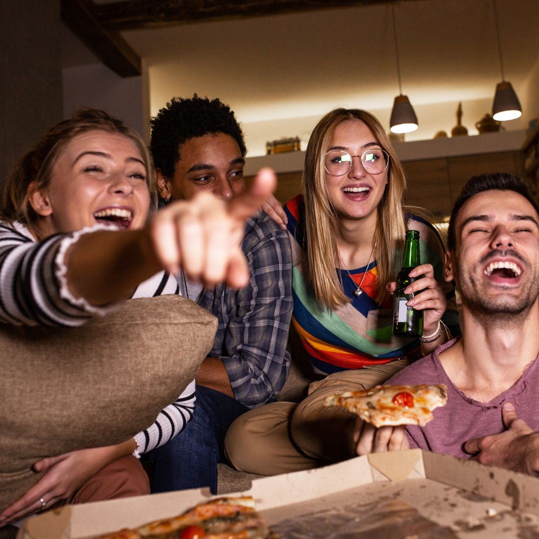 friends gathering eating pizza