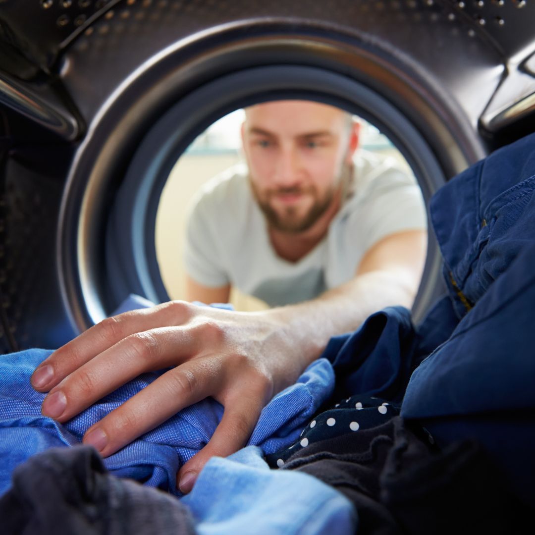 man doing laundry