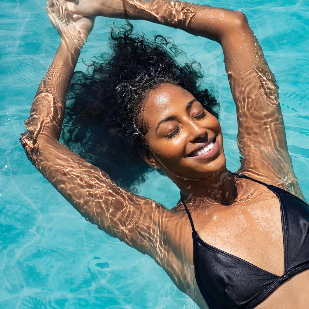 woman relaxing in swimming pool