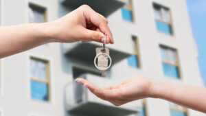 placing apartment key in persons hand