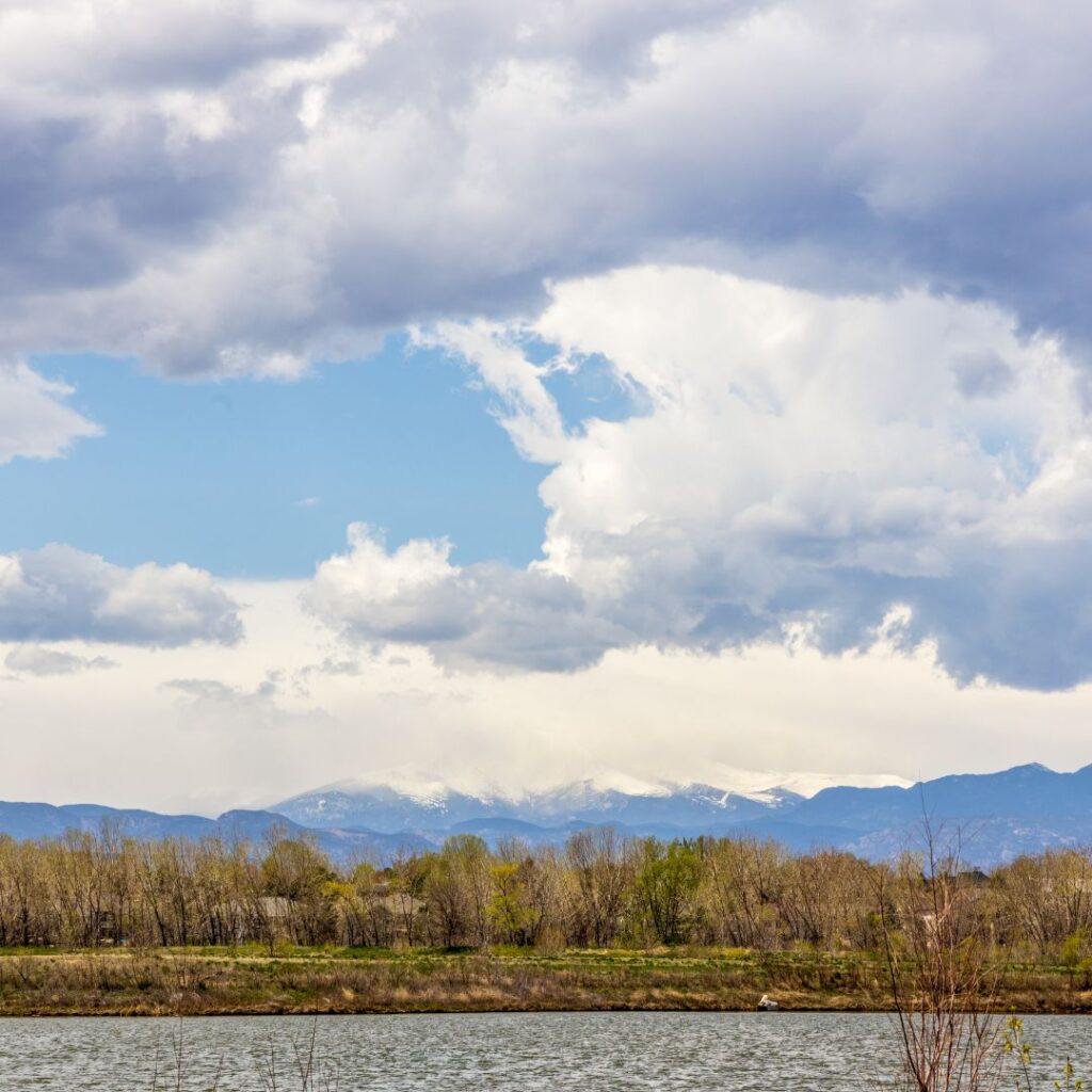 view of mountains and lake in Brighton, Colorado