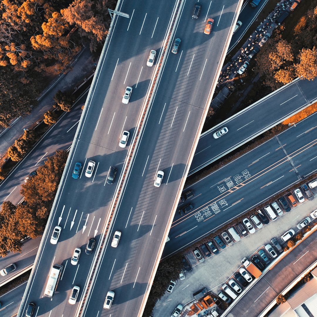 Aerial view of multilane highways with cars and trees