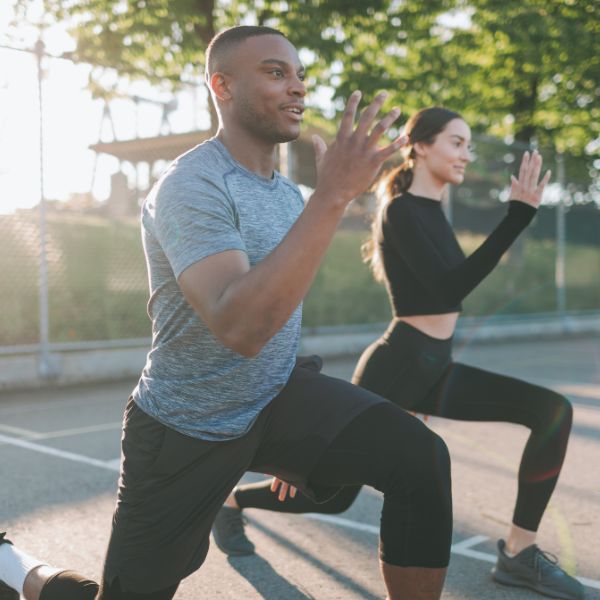 man and woman working out outside