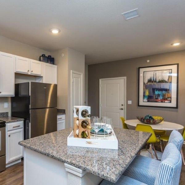 Luxury kitchen detail with granite countertops and stainless steel appliances.